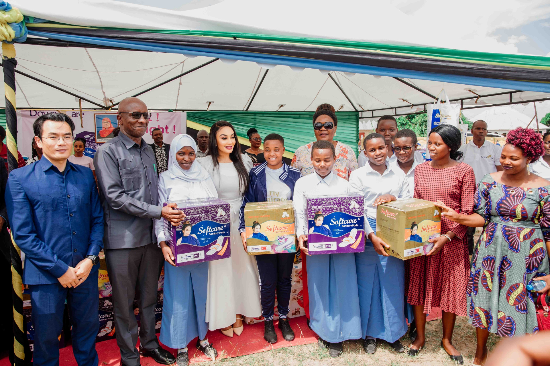 Recipients receiving essential supplies at a community distribution event