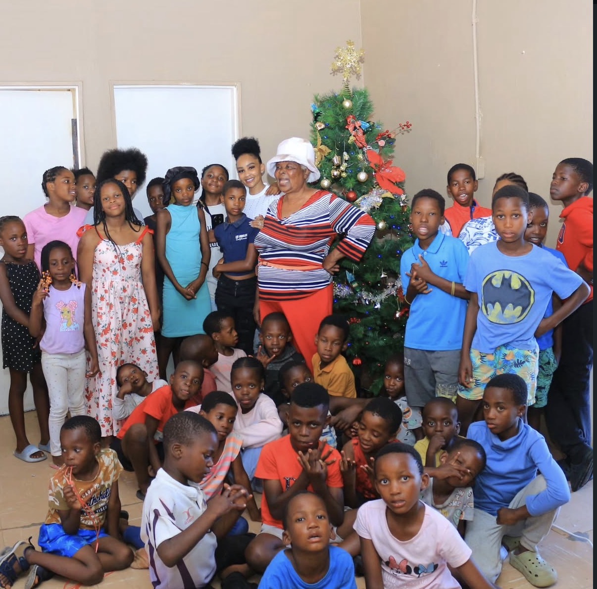 Children gathered together for a seasonal community gathering supported by the Zari Foundation
